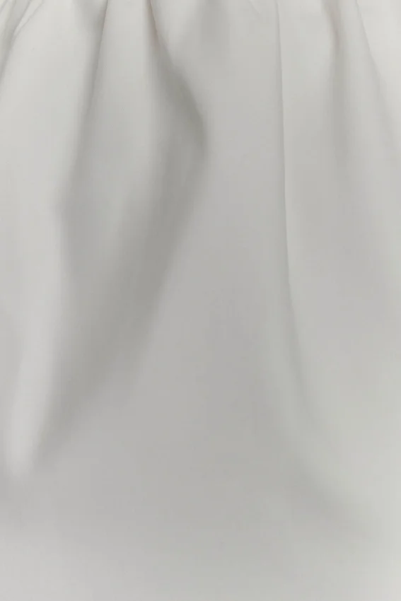 Ariana Pleated Neck Mini Dress – Ivory Ariana Pleated Neck Mini Dress – Ivory